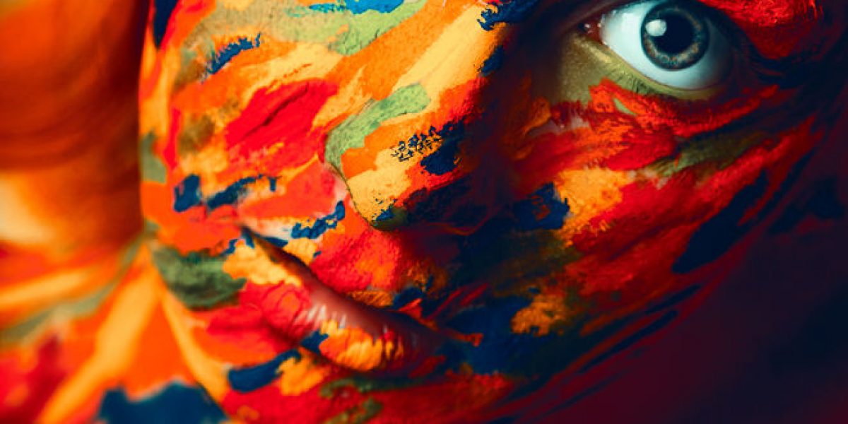 25579823 - portrait of adult woman with paint strokes on face in studio