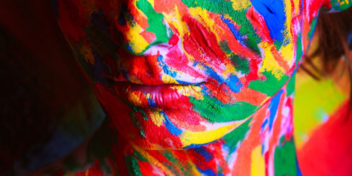 25605893 - skin of girl in colourful paint in studio